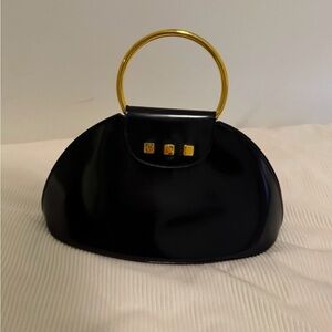 Elegant Black Delvaux Handbag with Gold Accents